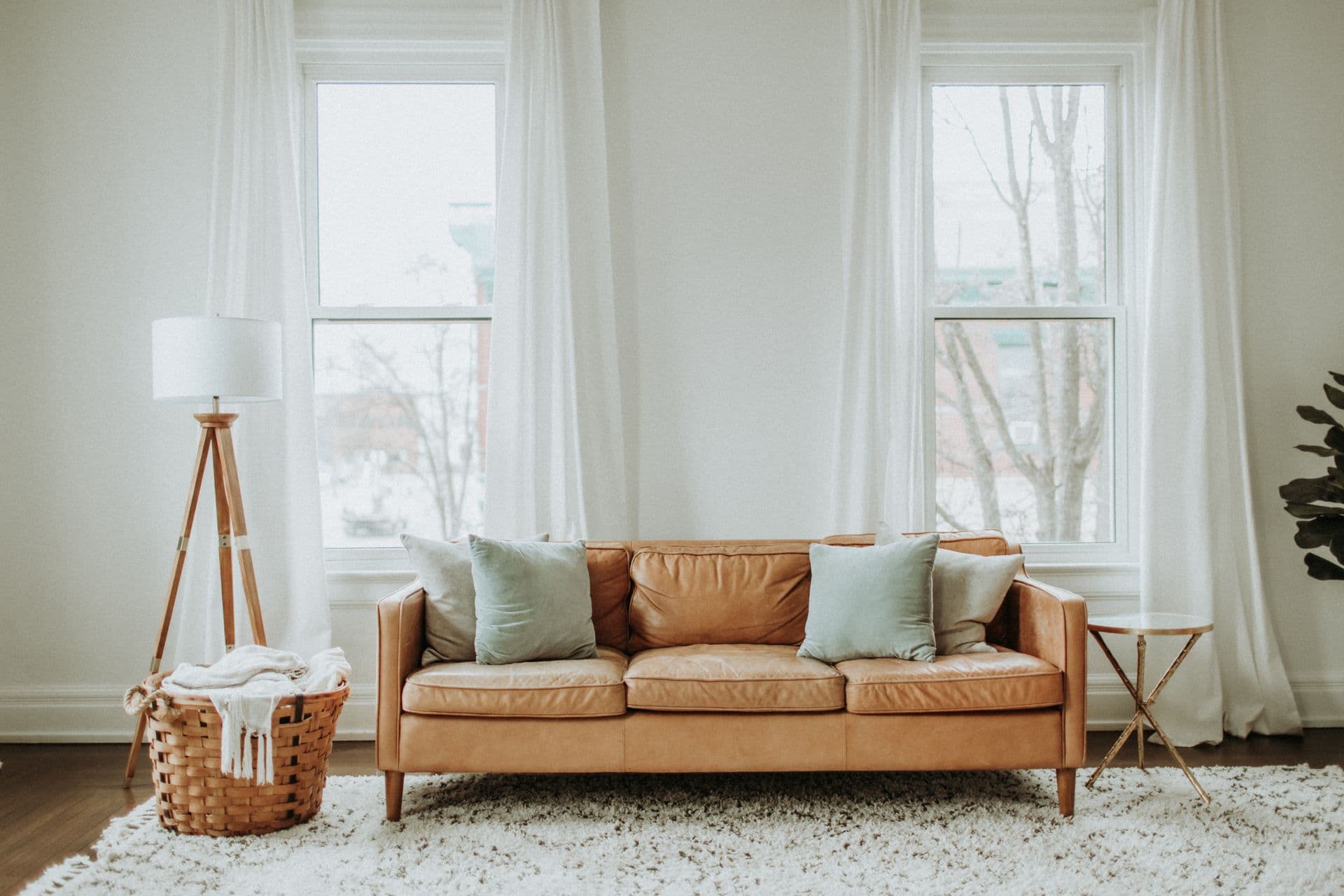 Restful bedroom styled with blackout drapery and sheers