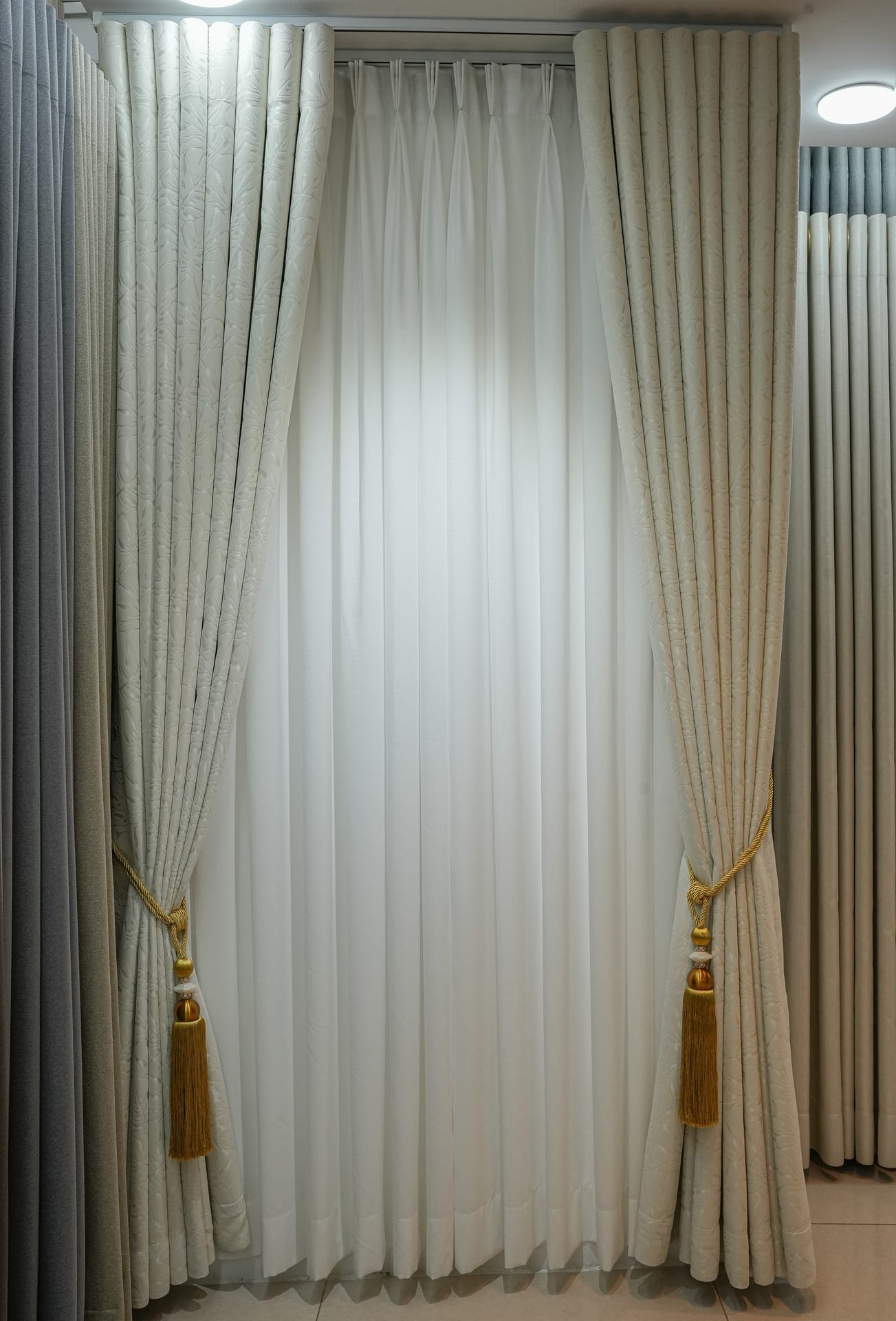 Full-height sheer curtain framed by lined side panels at the Hello Sun studio