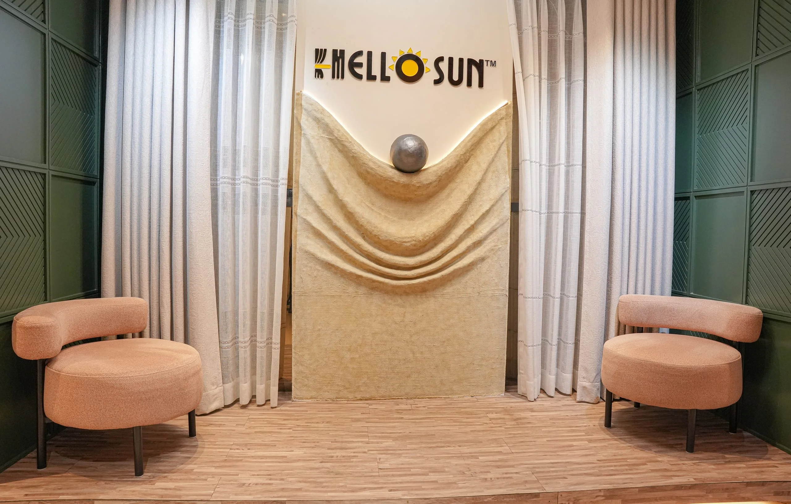 Hello Sun studio in Gulshan 2 with sheer curtains and lounge chairs