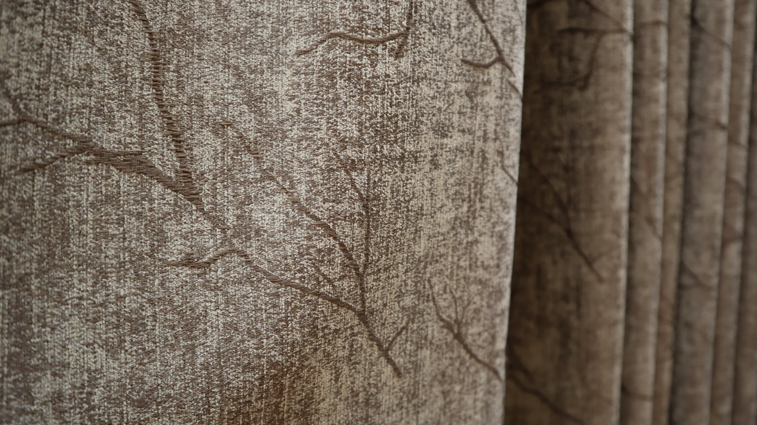 Heavy acoustic-style curtains in an interior space